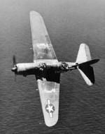 Interesting aerial view into the cockpit of an SB2C-4E or SBF-4E Helldiver with a Utility Squadron, probably in the western Pacific, 1945. Note the slotted wing flaps that served as dive-brakes.