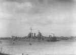 Cruiser USS Nashville anchored in the Huangpu River, Shanghai, China, Oct 1945 as flagship for the Yangtze River patrols. Photo 2 of 2.