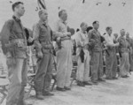 Lieutenant General Holland Smith and other officers paying respect to the fallen of US 4th Marine Division, Saipan, Mariana Islands, 14 Aug 1944