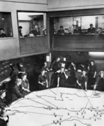 Duty officers and WAAF plotters at RAF Fighter Command No. 10 Group Headquarters Operations Room, RAF Rudloe Manor (RAF Box), Corsham, Wiltshire, England, United Kingdom, 1943