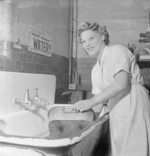 WAAF Leading AIrcraftwoman Gladys Maugham washing a baking tin at the RAF depot at Uxbridge, Middlesex, England, United Kingdom, 1944