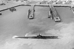 Submarines in the submarine basin and at the submarine piers at Midway, May 1945. Photo 2 of 2.