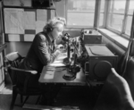 WAAF corporal radio telephony operator communicating with aircraft from the watch office at a Bomber Command station, United Kingdom, 1942-1945