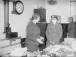 Duchess of Gloucester Princess Alice, Honorary Air Commandant of the WAAF, being briefed by WAAF cypher officer Lady Dorothy Bowhill on internal transmission of decrypted signals by Lamson Tube at the Headquarters of Coastal Command, RAF Eastbury Park, Northwood, Middlesex, England, United Kingdom, date unknown
