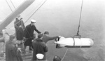 Prototype of a Mark 24 acoustic homing torpedo being recovered after a test off Boston, Massachusetts, United States, early 1942.