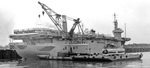 Reactivated as an aircraft transport ship in 1958, USNS Card is seen dockside in Saigon, South Vietnam (now Ho Chi Minh City, Vietnam) in about 1968.