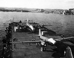 Postwar photo of surrendered Japanese aircraft secured to the deck of escort carrier USS Bogue for transportation to the United States, 25 Dec 1945, Yokosuka, Japan. Photo 1 of 2.