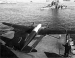Postwar photo of surrendered Japanese aircraft secured to the deck of escort carrier USS Bogue for transportation to the United States, 25 Dec 1945, Yokosuka, Japan. Photo 2 of 2.