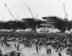 USS Casablanca (right) being prepared for launching two days later, Kaiser Vancouver Shipyard, Vancouver, Washington, United States, 3 Apr 1943; note Casablanca-class escort carriers Liscombe Bay, Alikula Bay, and Corregidor under construction