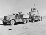 A Grant tank being loaded onto a Diamond T tank transporter, North Africa, 13 Aug 1942