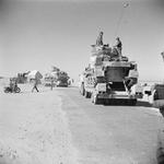 Grant tanks being carried on Diamond T Model 980 tank transporters along the coast road, Libya, 15 Jan 1943