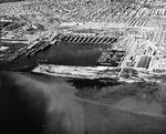 Aerial view of Permanente Metals Shipyard No. 2 looking north, Richmond, California, United States, 11 Dec 1944. Note the prefabrication sheds on the left angled 45-degrees to everything else.