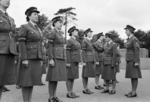 A WAAF officer, acompanied by a flight sergeant, inspecting a squad of WAAF Policewomen, RAF Police School at RAF Uxbridge, Middlesex, England, United Kingdom, 1940s