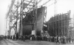 Launching of Ehrenfels, Deschimag shipyard, Bremen, 23 Dec 1935, photo 1 of 3; note Reichenfels under construction on the right of the photograph