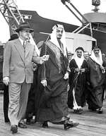 Marinship Company president Stephen Bechtel, Sr., left, and HRH Prince Faisal Ibn Abdul Aziz of Saudi Arabia and his party touring the Marinship yard, Sausalito, California, United States, 25 Apr 1945.