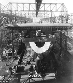 Essex-class carrier Ticonderoga being prepared for christening and launching, Newport News, Virginia, United States, 7 Feb 1944. Note the platform built for the sponsor and other dignitaries.