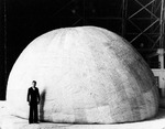 A captured and partially reinflated Japanese Fu-Go Type A balloon bomb inside the blimp hangar at Naval Air Station Moffett Field, Mountain View, California, United States, Aug 1945.