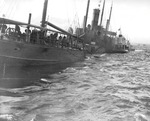 Freighter SS Absaroka with her decks awash after being torpedoed by Japanese submarine I-19 off the San Pedro harbor entrance, Los Angeles, California, United States, 24 Dec 1941.