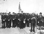 LtCdr Franklin Karns preparing to take command of the destroyer USS Bailey upon commissioning at the New York Navy Yard, 11 May 1942. Yard commandant RAdm Edward Marquart is at the microphone.