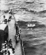Destroyer USS Bailey prepares to bring aboard two Navy fliers whose airplane had run out of fuel 17 miles west of Guam, 31 Jan 1945. The fliers had been in the water over 24 hours.