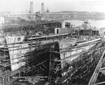 The hulls of destroyers Nicholas (left) and O’Bannon (right) under construction at the Bath Iron Works, Bath, Maine, United States, 1 Jan 1942. These two ships would be side-by-side for much of their careers.