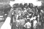 Mail call on the fantail of the USS Nicholas, 1943. Note the barrel of No. 5 5-inch/38 gun mount at left and smoke generators between the two depth charge racks at the stern.