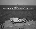 Cruiser USS Boise passing carrier USS Yorktown (Essex-class) in Chesapeake Bay, Virginia, United States, 6 May 1943. Note Boise’s Measure 22 paint scheme and F6F-3 Hellcat fighter on Yorktown’s deck-edge elevator.