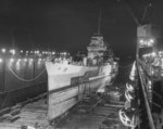 Cruiser USS Honolulu in Drydock #3 at the Norfolk Navy Yard, Portsmouth, Virginia, United States, Jan-Mar 1945. After repairs were completed, Honolulu finished her career as a training ship.