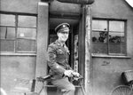 Master Sergeant Edward Gregory of the 306th Bomb Group in front of an orderly room at RAF Thurleigh, Bedfordshire, England, mid-1943. MSgt Gregory was the crew chief for the B-17 ‘Rose of York’.