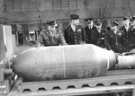 Supreme Allied Commander General Dwight Eisenhower (left) and other dignitaries examining a 4,000-pound bomb at RAF Bassingbourn in Cambridgeshire, England in the spring of 1944.