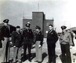 The squadron commanders of the 306th Bomb Group gathered in front of the base control tower at RAF Thurleigh, Bedfordshire, England, circa 1944.