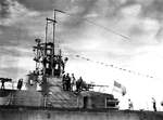 Conning tower and periscope shears of Gato-class submarine USS Silversides as seen from submarine tender USS Fulton, Apra Harbor, Guam, 18 Aug 1945.