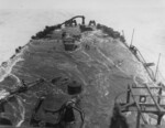 Wrecked Mikazuki being inspected by USMC personnel, off Cape Gloucester, New Britain, 8 Feb 1944; note stern, viewed from the after deckhouse