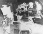 Wrecked Mikazuki being inspected by USMC personnel, off Cape Gloucester, New Britain, 8 Feb 1944; note 4.7-inch gun on the after deckhouse without breechblock
