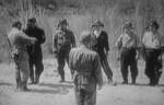 Yukio Seki receiving ceremonial water from his commanding officer Captain Asaiki Tamai before Seki