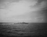 HMAS Hobart (foreground) and either HMAS Australia or HMAS Shropshire (background) in exercise in the South China Sea off Subic Bay, Philippines, circa Aug 1945, photo 2 of 2