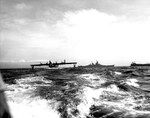 PB2Y Coronado seaplane carrying US Fleet Admiral Chester W. Nimitz arriving at Tokyo Bay 29 Aug 1945 for the surrender ceremonies five days later. USS Missouri is in the center background.