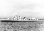 Profile view of destroyer USS Saufley in her 1943 Measure 22 blue and gray paint scheme. Note her two sets of torpedo tubes amidships. The radar and gun director antennas have been removed by the censors.