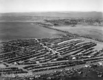 Five Curtiss Jenny’s with the United States Army Air Corps flying in formation above Mines Field, Inglewood, California during the 1928 National Air Races, 15 Sep 1928.