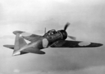 Rear quarter view of a captured A6M5 Zero fighter in flight, 25 Sep 1944