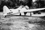 Captured Japanese A6M Zero fighter at Bougainville, Solomon Islands, Sep 1945; note missing stabilizer on aircraft and jeep in background