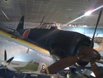 Japanese A6M Zero fighter on display at Smithsonian National Air and Space Museum, Washington DC, United States, 26 Dec 2011; note British Spitfire fighter in background