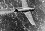 B5N torpedo bomber descending into the sea after being damaged in combat off Truk, Caroline Islands, 2 Jul 1944; note rear gunner standing up from open canopy