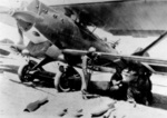 Turkish female aviator Sabiha Gökçen watching armorers at work on her Bre.19 light bomber, 1937-1938