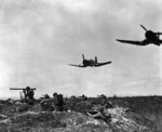 US Marines fighting in Korea, 1 Jan 1953; note Corsair in flight overhead