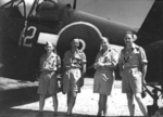 Pilots R. Devin, T. W. Tremayne, F. McBride, and P. J. Sheehan of No. 16 Squadron Royal New Zealand Air Force with a F4U-1 Corsair fighter, Green Island (now Nissan Island), 21 Dec 1944