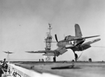 F4U-1 Corsair fighter of US Navy squadron VF-17 landing on USS Charger, Feb 1943