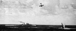 A D3A1 dive bomber about to crash into the sea near USS San Diego, Battle of the Santa Cruz Islands, 26 Oct 1942; seen in 15 Apr 1943 issue of US Navy publication Naval Aviation News