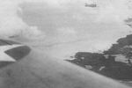 Lieutenant Commander Bill Burch and Ensign Thomas Reeves flying SBD dive bombers over Makin, Gilbert Islands, 1 Feb 1942