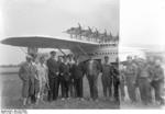 German pilot Christiansen, American pilot Schildhauer, and others posing with a Do X flying boat before making a trans-Atlantic flight from Europe to North America, Nov 1930